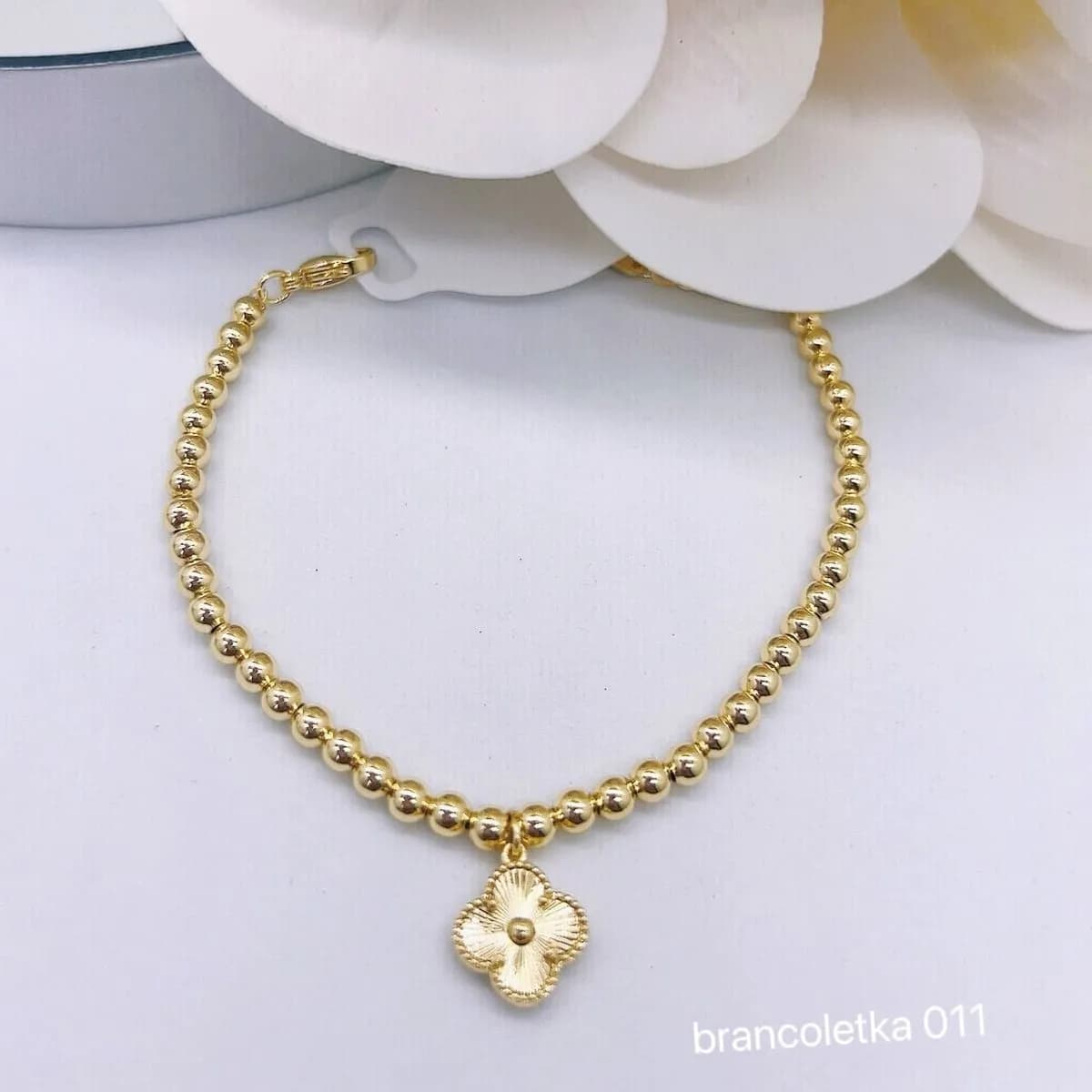 Bransoletka damska złota z zawieszką kwiatową