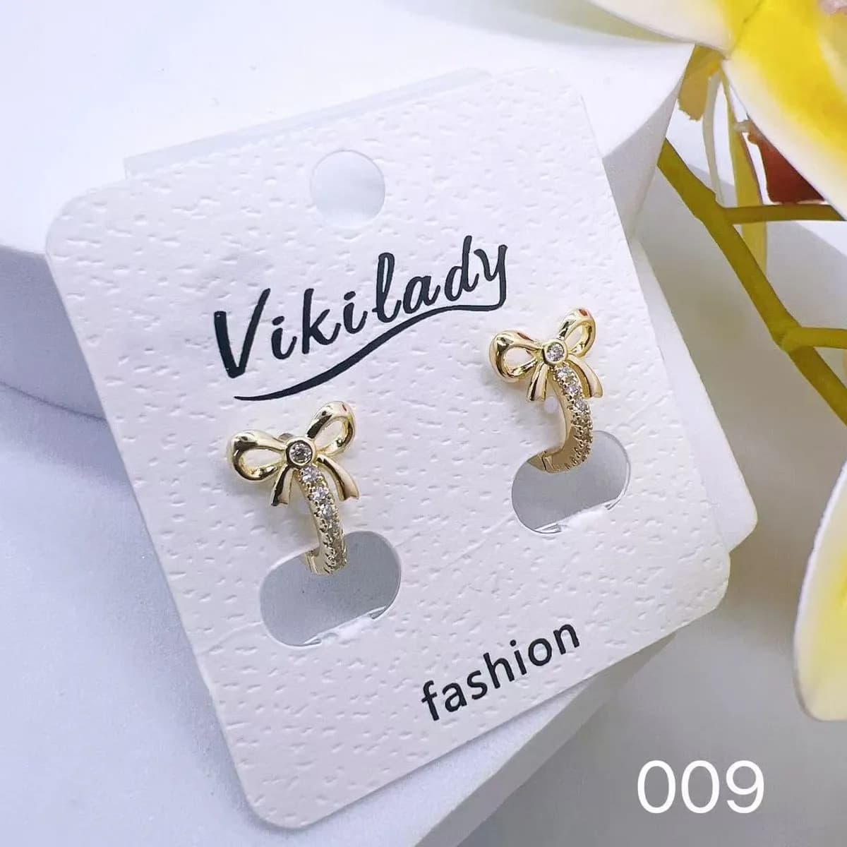 Kolczyki Damskie Złote Kokardki z Cyrkoniami Vikilady 24 szt.