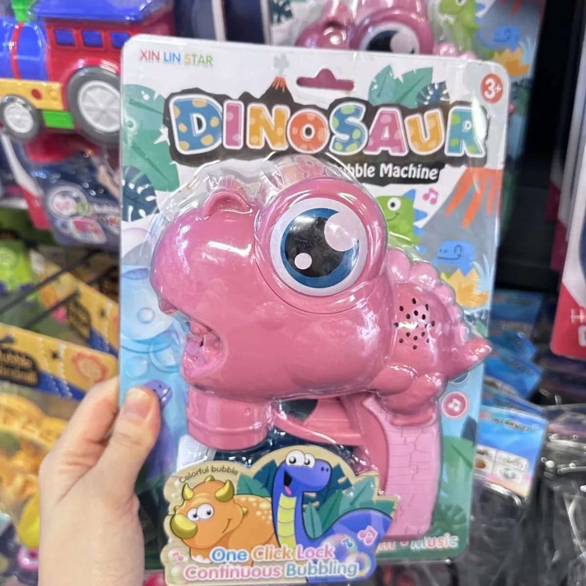 Pistolet do baniek Dinosaur Bubble Machine różowy, z muzyką i światłem