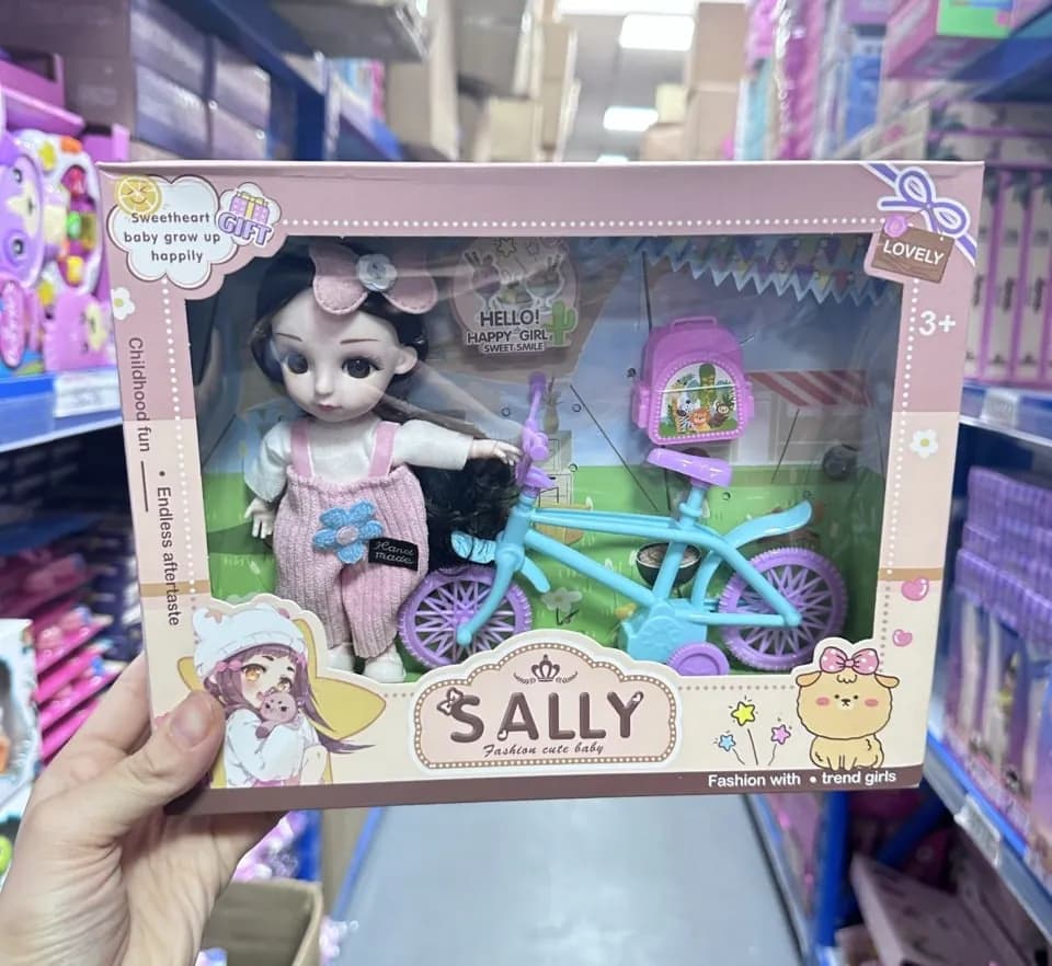 Lalka Sally z rowerkiem i akcesoriami, różowy kombinezon