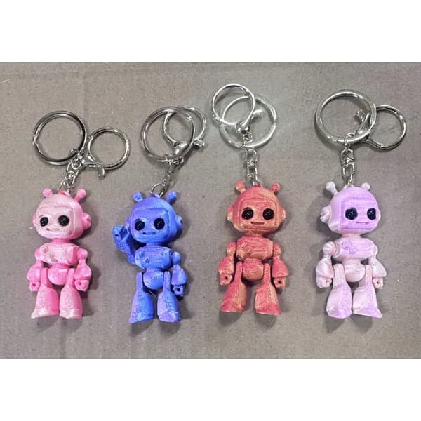 Brelok robot figurka 3D ruchome kończyny mix kolorów 24szt