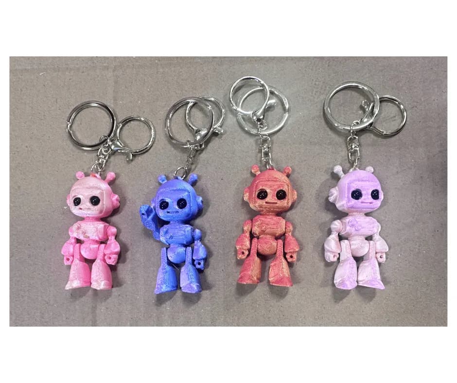 Brelok robot figurka 3D ruchome kończyny mix kolorów 24szt