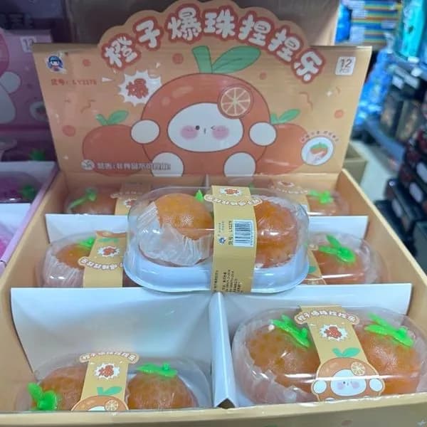 Zabawki Squeeze pomarańczowe kulki sensoryczne - gniotek pomarańcza