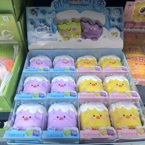 Zabawki antystresowe Squeeze fioletowe i żółte 12 szt. Pinching Music