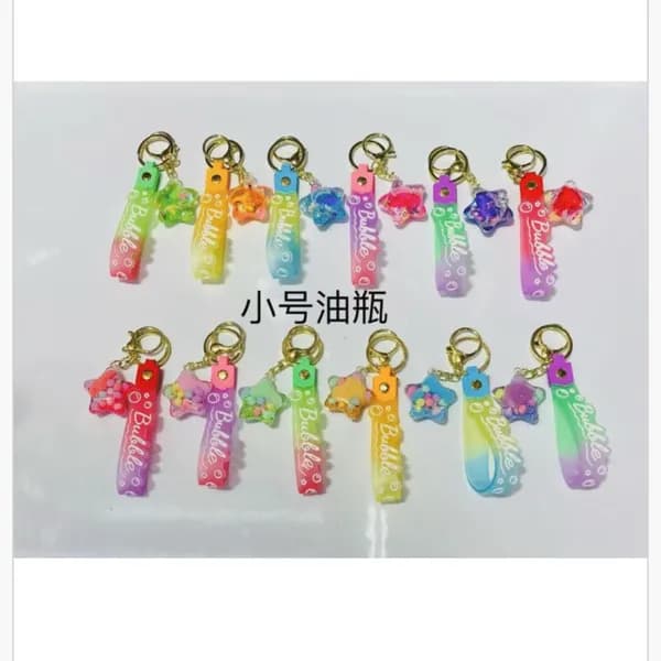 Brelok do Kluczy Gwiazdka z Płynem i Paskiem Bubble 24szt